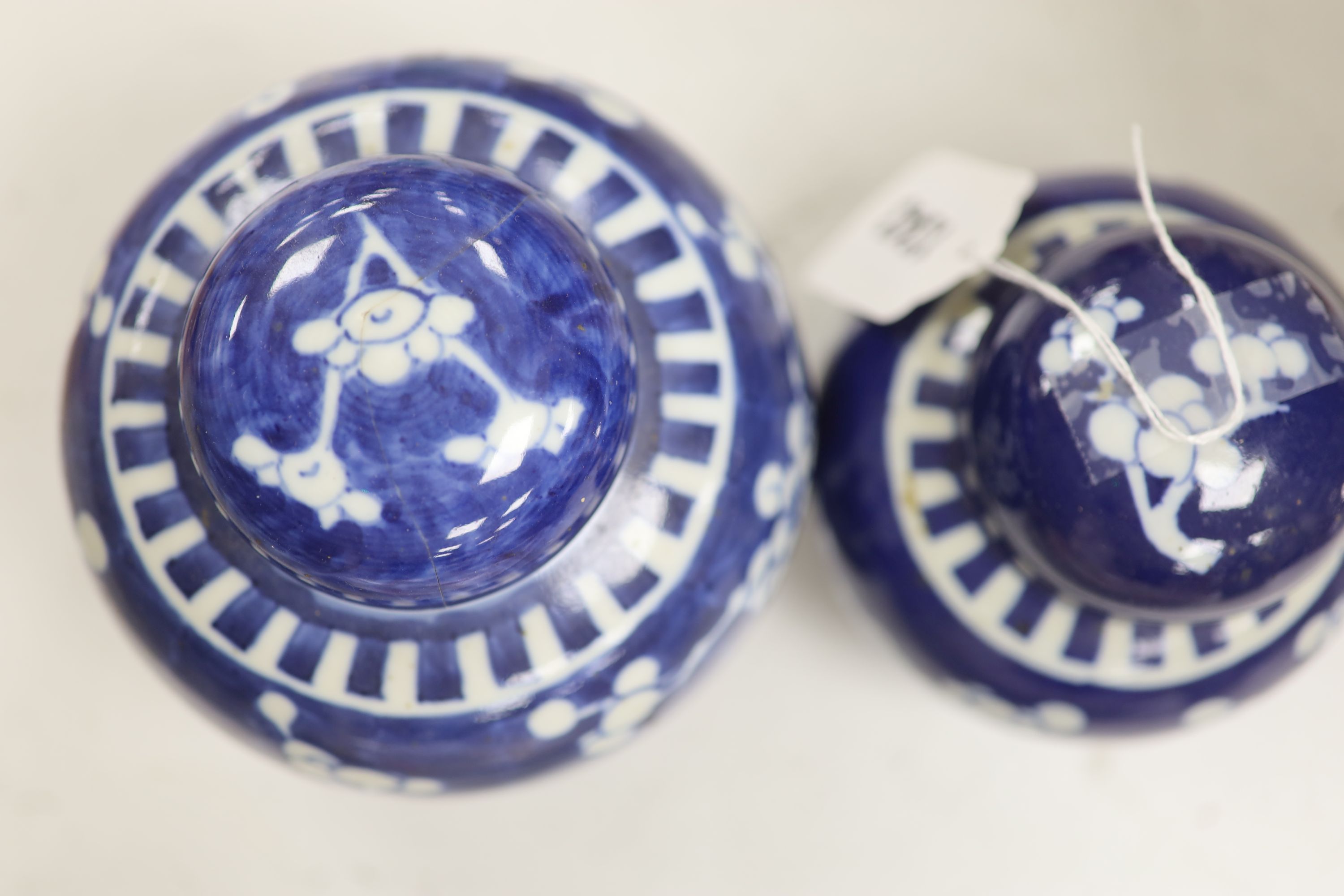 An early 20th century Chinese blue and white ‘prunus’ vase a Republic period millefleur dish, a similar Canton vase and two blue and white jars